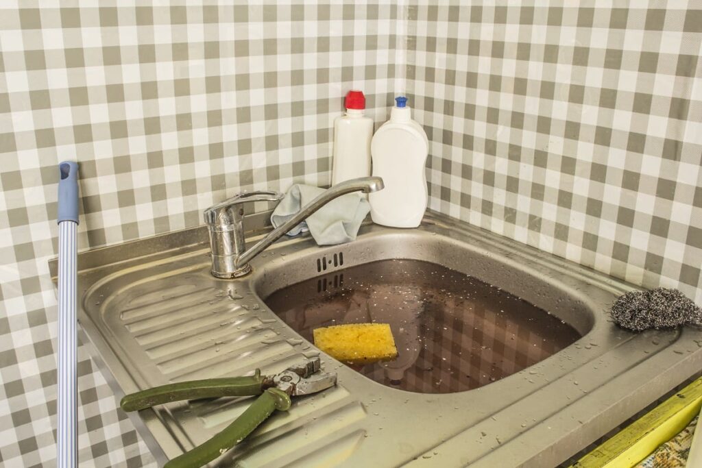 Unclogging a Coffee-Clogged Sink: Step-by-Step Guide - Bill Howe Sink Clogged with Coffee Grounds