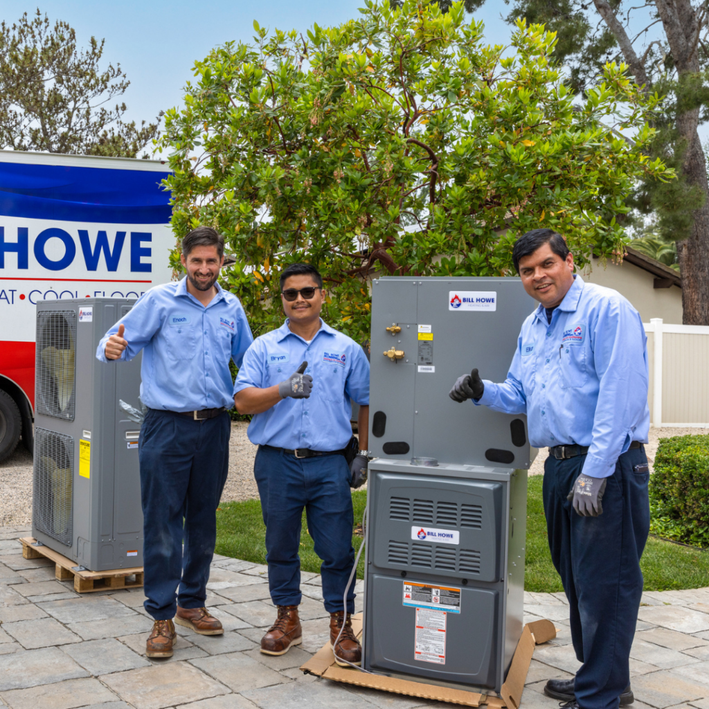 HVAC technicians smiling with their thumbs up, ready to install a new system.